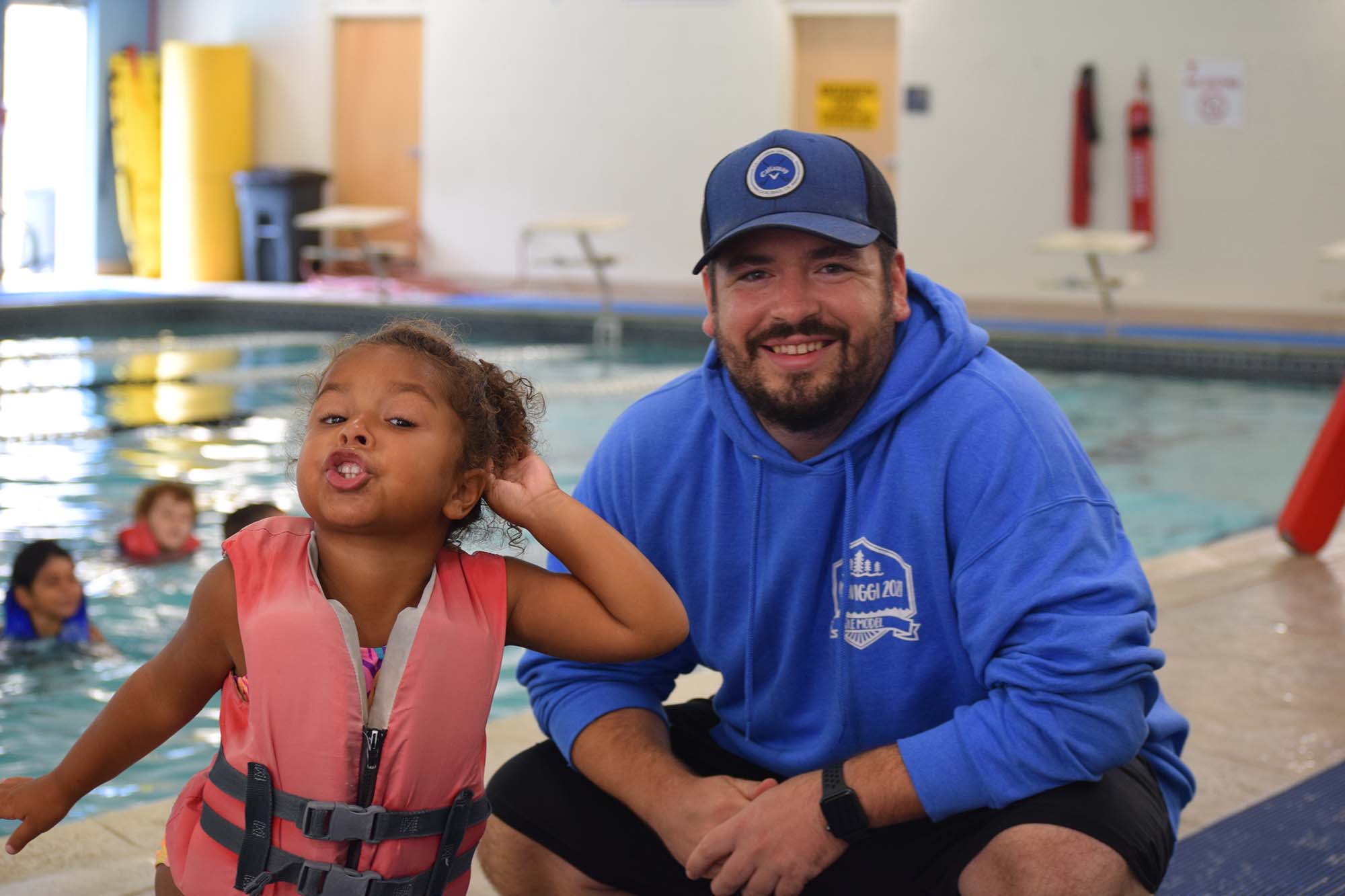 Alex Dorson with a young swimmer